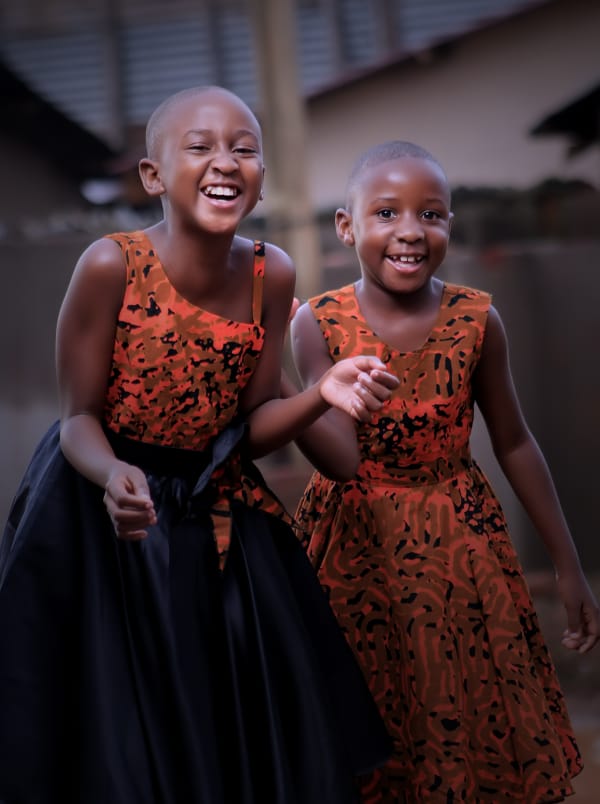 Abigail Mulungi, The Astonishing TikTok Newsreader 2 Abigail Mulungi and sibling