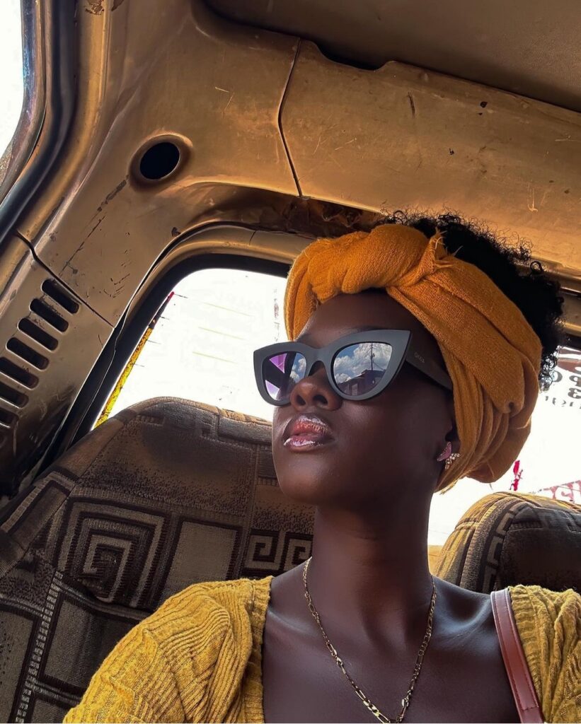Angella Summer Namubiru Wins E! People's Choice Awards 5 Angella Summer Namubiru in a taxi with sunglasses