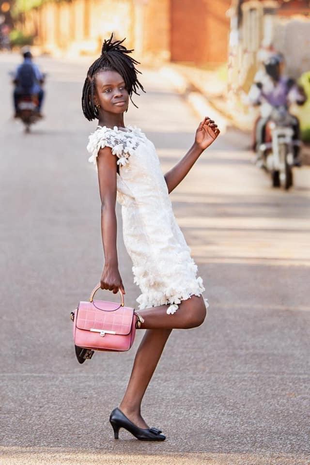 Enrika Mijumbi Kabagenyi in white short dress
