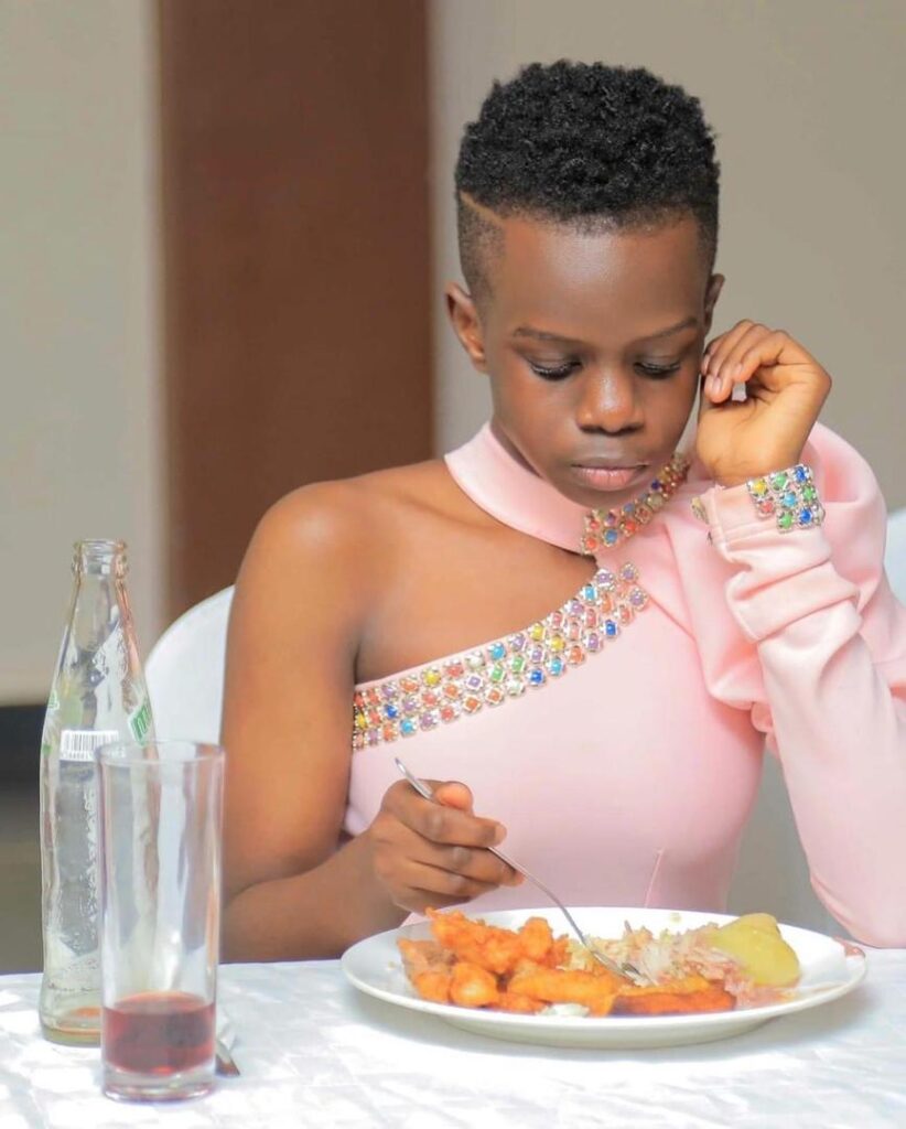 Enrika Mijumbi Kabagenyi eating food