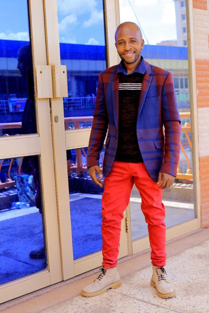 Bryan Morel | A Blend Of Music, Charity And Adaptability 2 Bryan Morel poses in dope blazer and red trouser