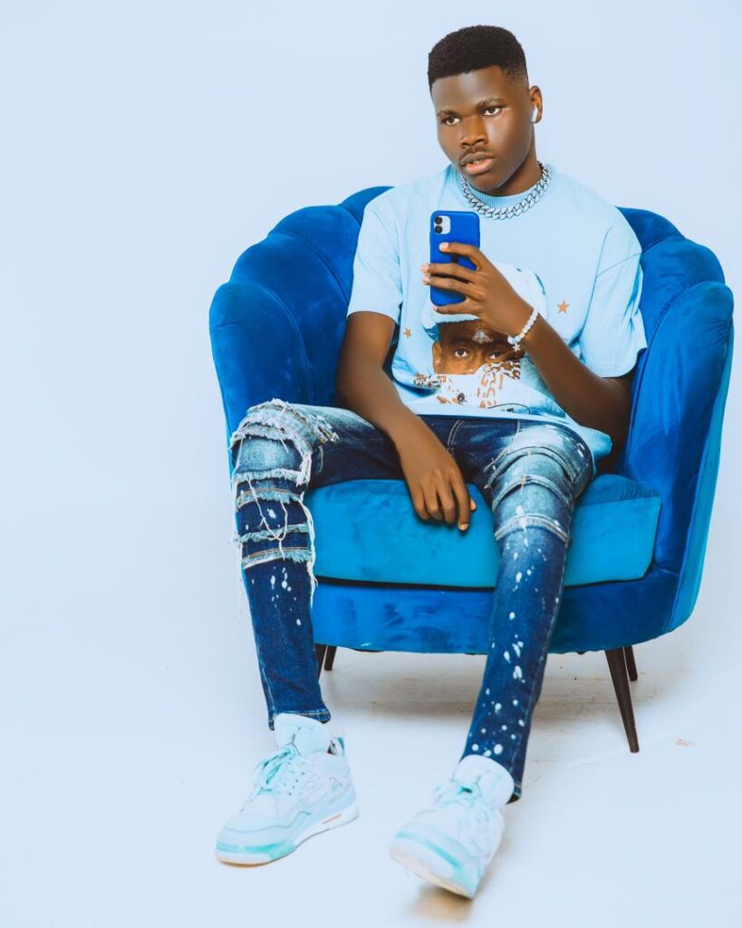sits on blue chair