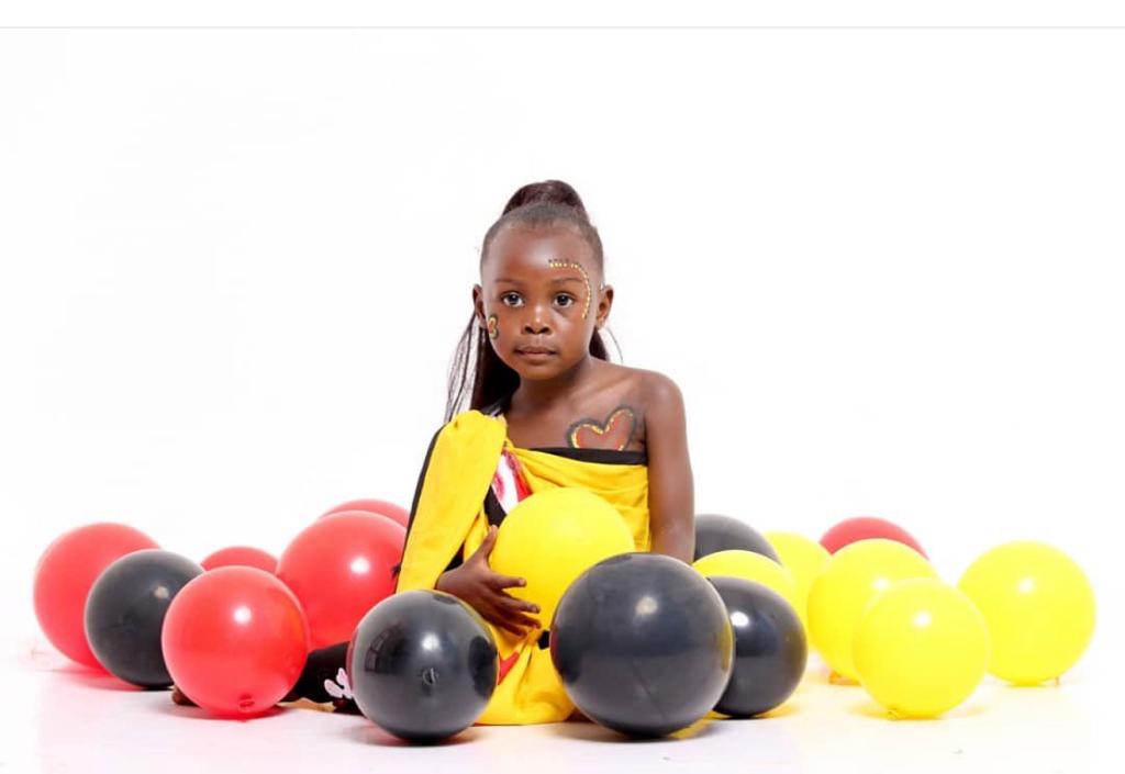in yellow dress with balloons 