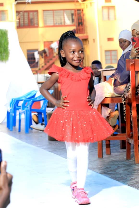 Baby Adeuiz walks in red dress
