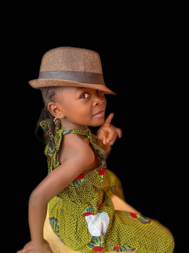 Baby Adeuiz with a black hat