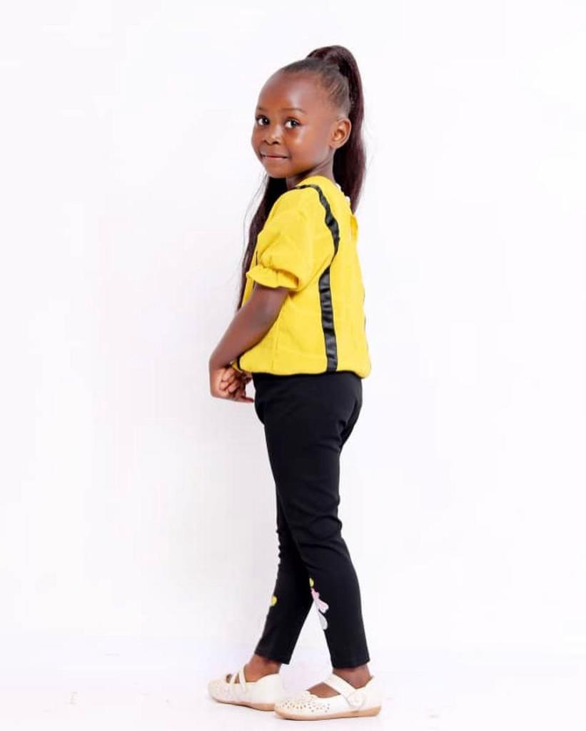 Baby Adeuiz in yellow blouse and black trouser