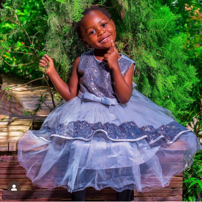 Mijumbi Eleanora Adeuiz in blue dress