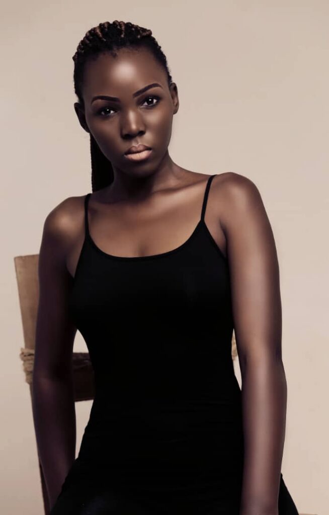 Justine Mukisa | Brave Ugandan Model Who Defeated Cancer 6 beautiful black skin girl in black dress and nice lip gloss