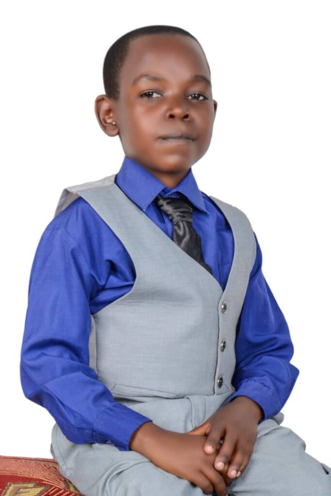 Wasswa Mubarak in a half coat suit with a blue shirt