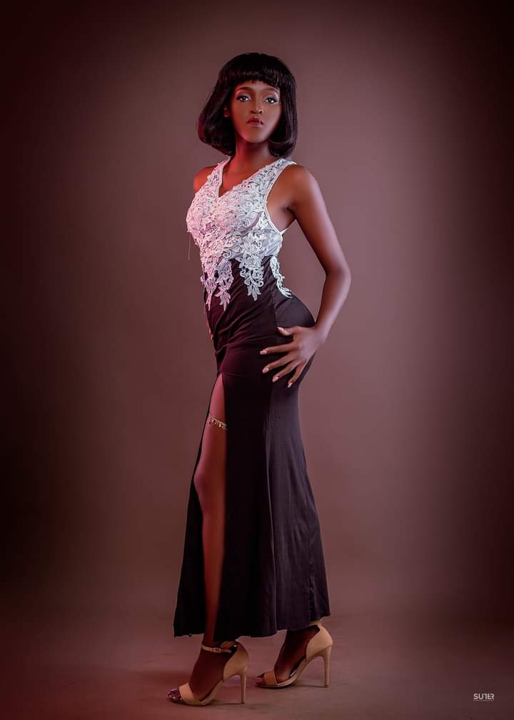 Herman Michelle The Model Talks About Success 27 black beautiful ugandan model in white top and black long slit skirt