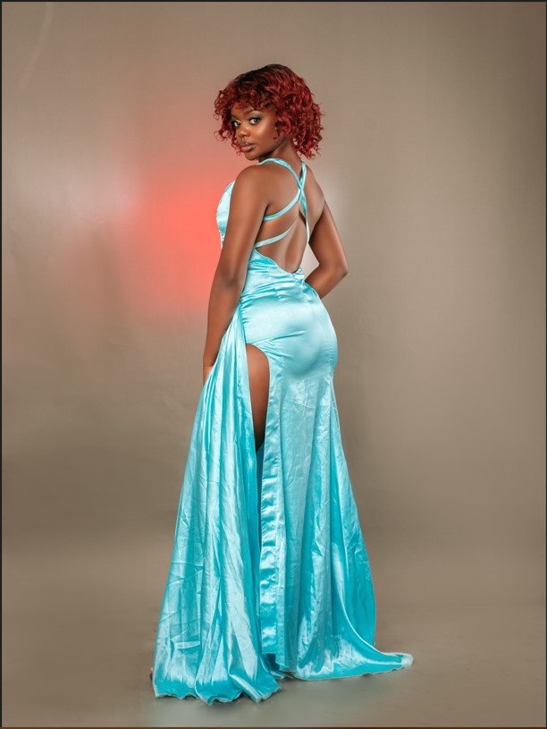 beautiful black woman in blue dress with long slit
