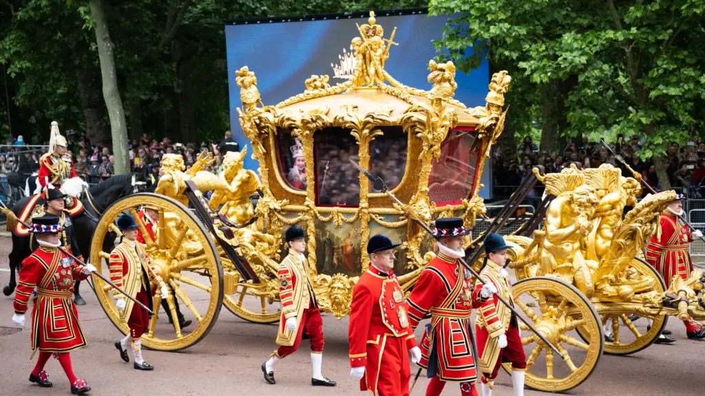 King Charles Coronation marching in chariot