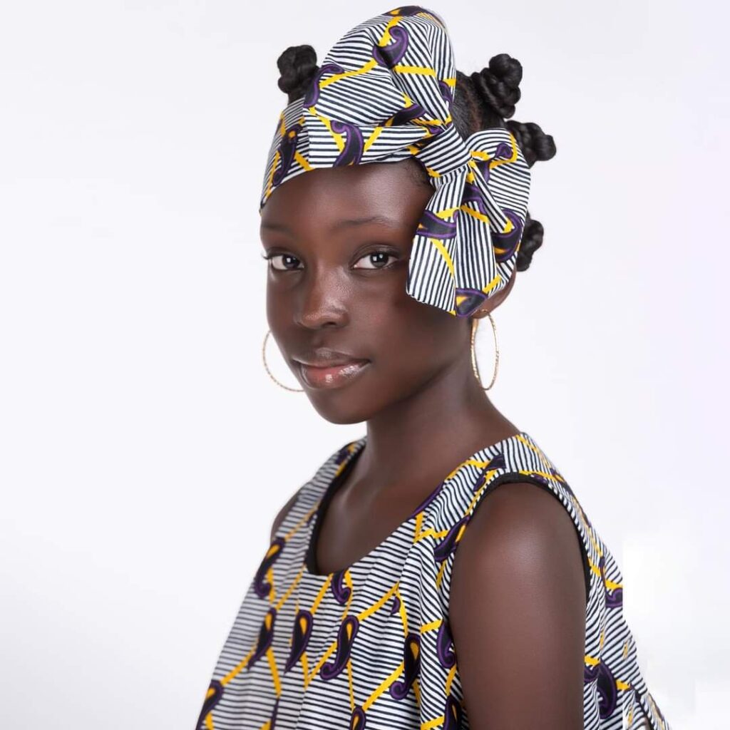 Mugasa Myra | Unravelling The Dazzling Ugandan Kid Model 19 Mugasa Myra in simple african wear