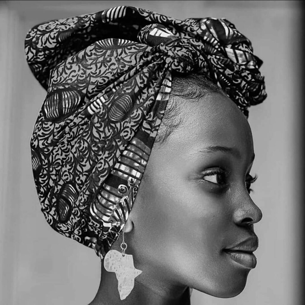 Mugasa Myra | Unravelling The Dazzling Ugandan Kid Model 9 Mugasa Myra with africa map earring and african head clothing kitengi