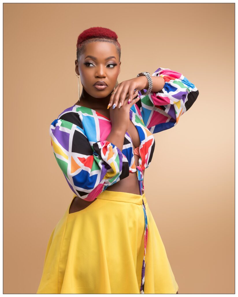 Stella Nante | Most Beefed NTV Deception Actress' Story 3 stella nante posing in a beautiful multicolored blouse and yellow dress