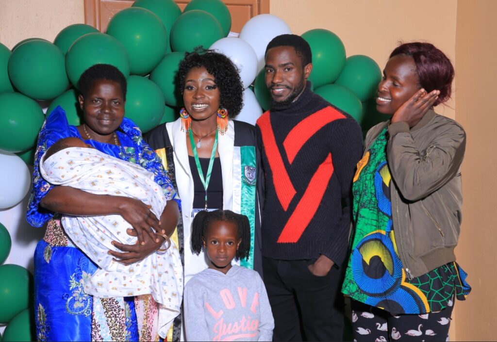 charity poses with family members from tororo