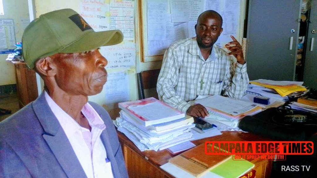 Mr Osuna ( in cap ) the DOS of RASS Mr Mpagi 