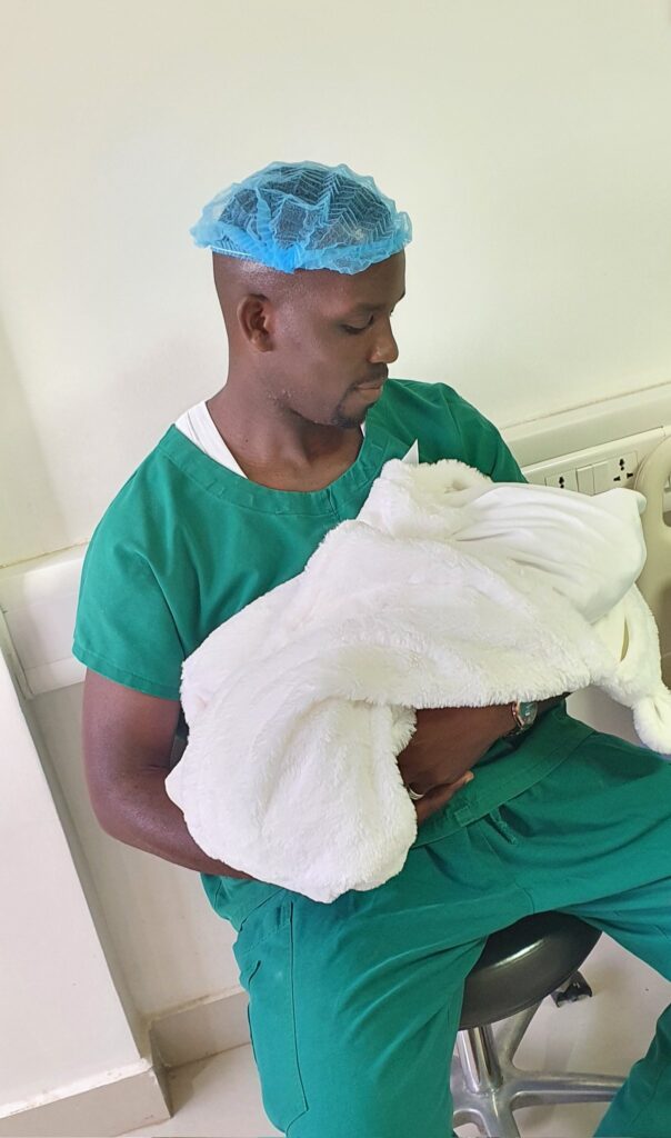 Joel Ssenyonyi carries baby boy hezekiah