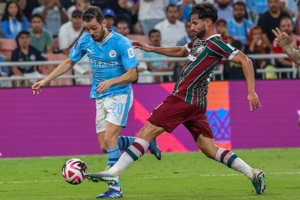 Bernardo Silva of City ( right ) against a Fluminense player in the FIFA Club World Cup Final