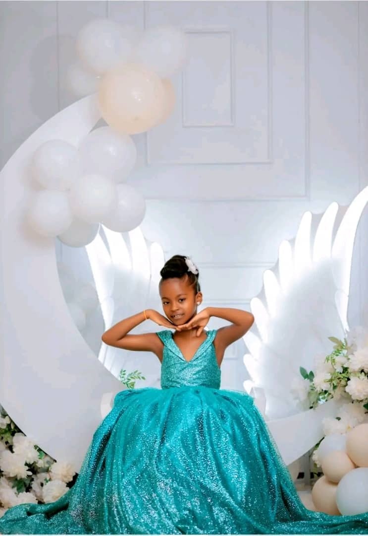 Mairah Muwanga Adams IN LIGHT BLUE DRESS