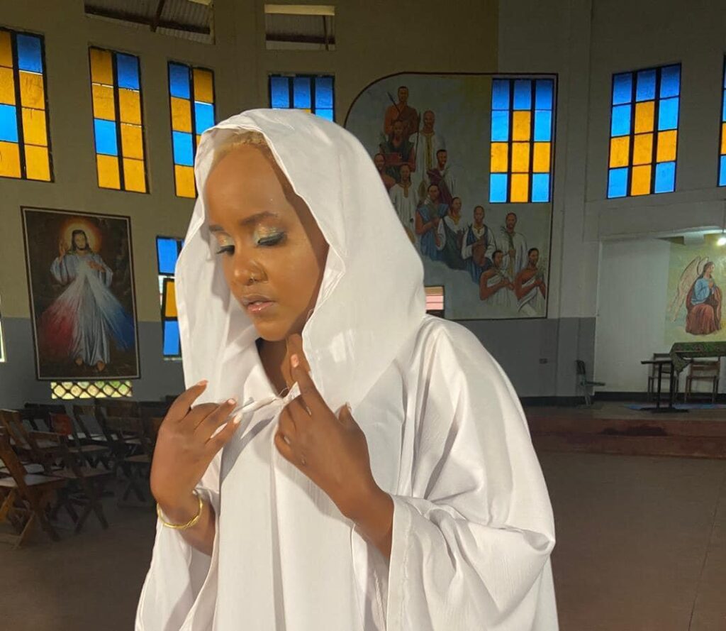Meet Princess Sandra Elias, Maid In The Sanyu Series 37 Sandra Elias dressed in white in a church
