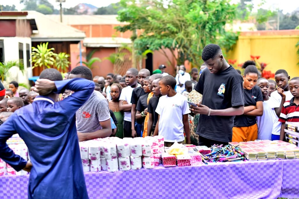 Allan Kato's Impact on Less Privileged Children 14 Allan Kato distributes gifts to kids