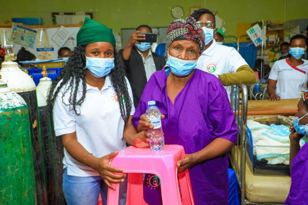 Inspiring Outreach at Mbale Hospital - Shendi Foundation 5 Wetsetse Suzan handing over the stool to a mother