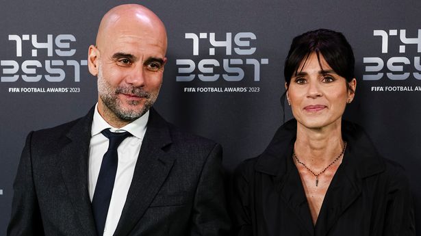 Pep Guardiola posing with his wife Cristina Serra